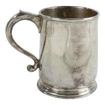 A Georgian silver mug - London 1806, of baluster form and on a circular foot, engraved with armorial