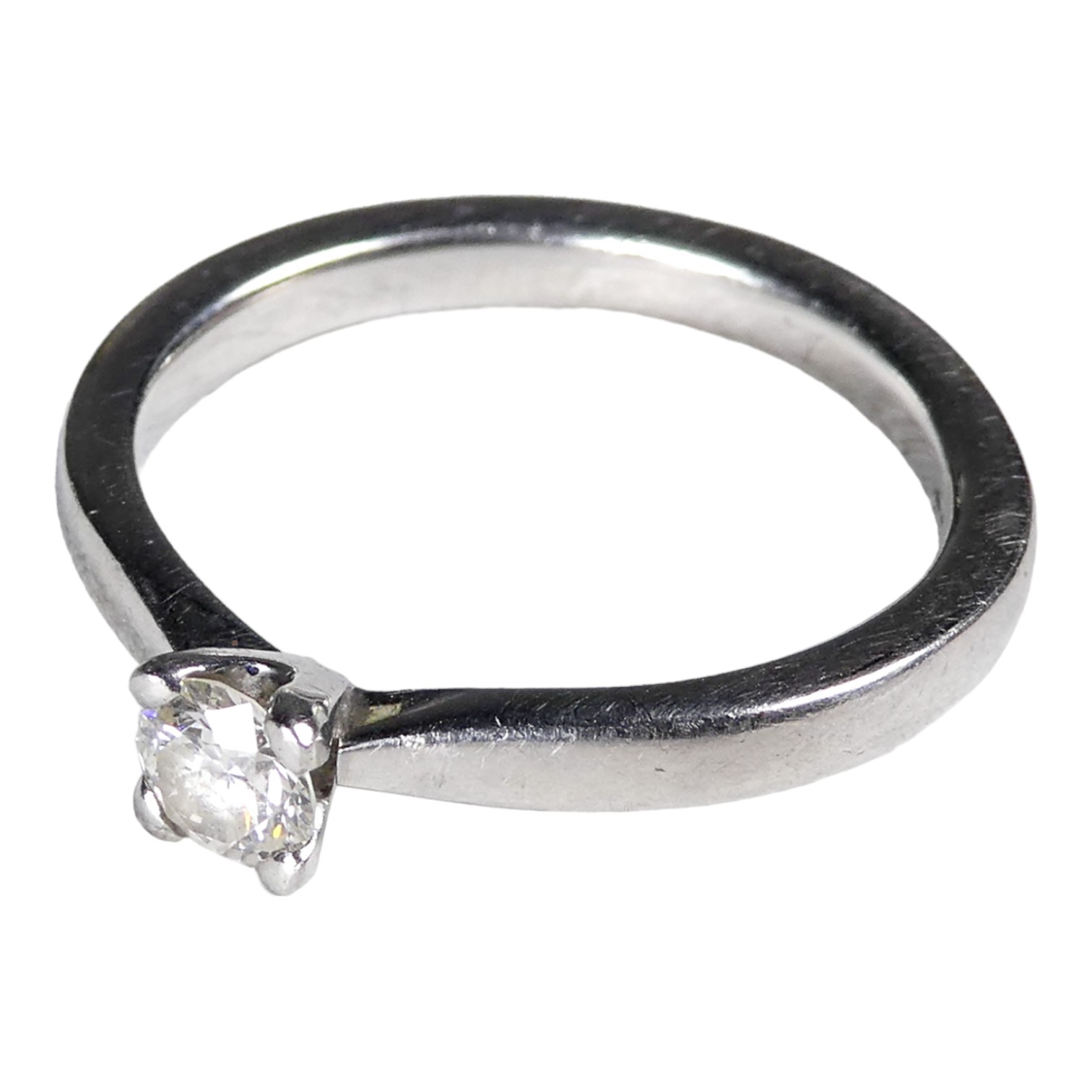 A platinum solitaire diamond ring - with claw setting, size M, weight 5.2g.