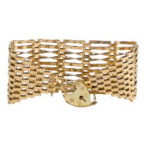 A 9ct gold gatelink bracelet - with a heart shaped clasp, weight 23g.