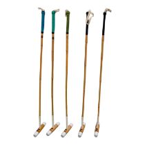 Five full size polo mallets - M.H. Geoffrey & Co. full size, with a bag.