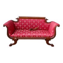 A William IV style mahogany sofa - with shaped back and scroll ends, the red fabric decorated in