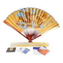 A large 20th century Japanese fan - decorated with two dragons and a flaming pearl, on a gilt