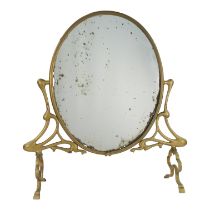 An Art Nouveau style brass table mirror - with an oval plate and stylised foliate supports, 67 x