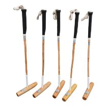 Five child's polo mallets - size 31', M.H. Geoffrey & Co. full size, with a bag.