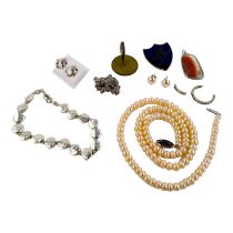 A pearl necklace - of uniform oval beads, length 47cm, together with a silver ropetwist chain and