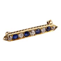 An 18ct gold diamond and sapphire bar brooch - with nine alternate set stones, weight 3.3g.