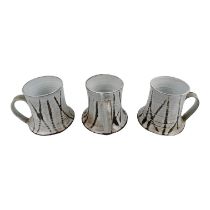 Jess Val Baker three studio pottery mugs - white sgraffito glaze, impressed mark to base on