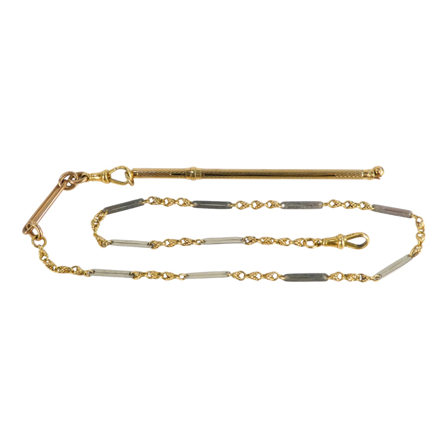 A 9ct gold swizzle stick - engine turned, on a gilt metal chain with 18ct gold clasps, weight 18g.