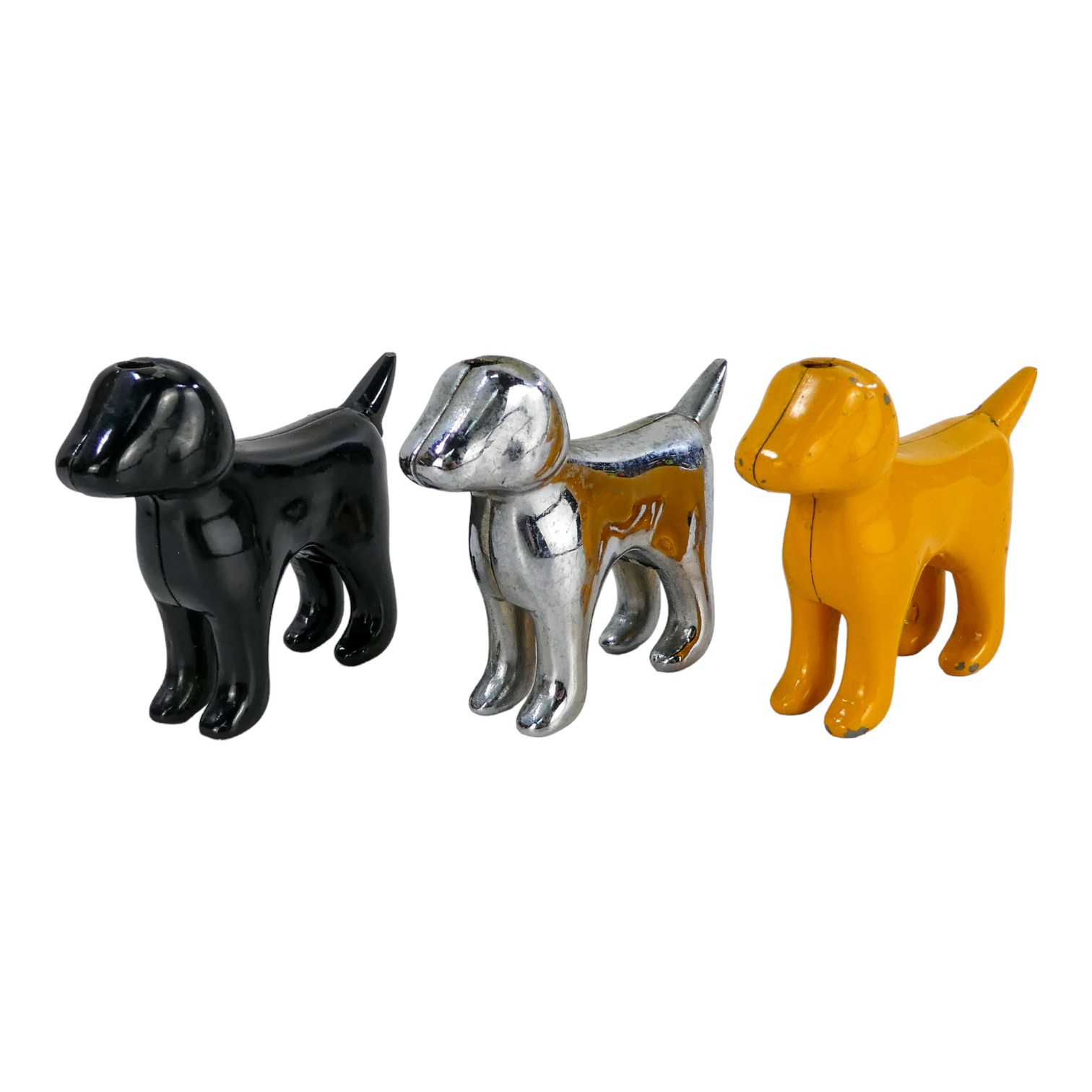 A 20th century table lighter in the form of a dog - chrome, height 6cm, together with two similar,