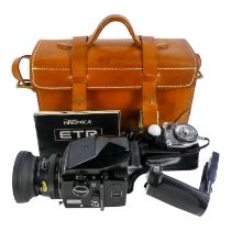 A Zenza Bronica ETRS camera - fitted with a 75mm f/2.8 lens, with a prism viewer, film back and