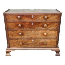 A George III mahogany chest of drawers - with stop-fluted canted corners and an arrangement of