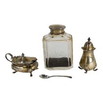 A glass and silver mounted tea caddy - rectangular with canted corners, together with a silver