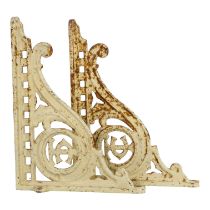 A pair of cast metal brackets - scrolled supports and incorporating the initials TC