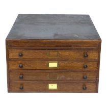 A 19th/20th century oak collector's cabinet - with an arrangement of four drawers and a lidded