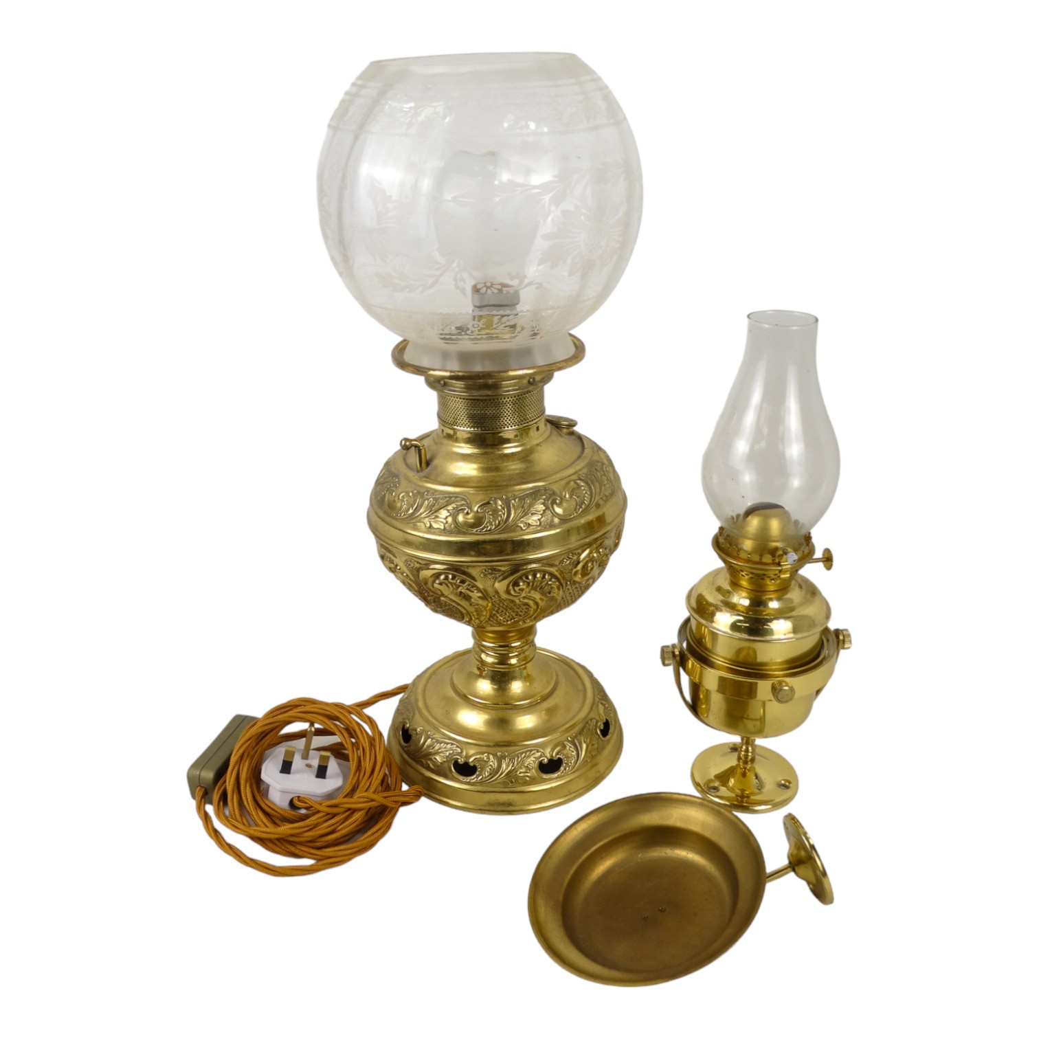 An early 20th century brass oil lamp - with foliate repousse reservoir and etched glass globe, - Image 2 of 2