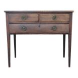 A George III mahogany side table - the rectangular top above an arrangement of two short and one