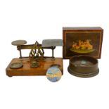 A set of brass postal scales - with oak base and selection of graduated weights, together with a box