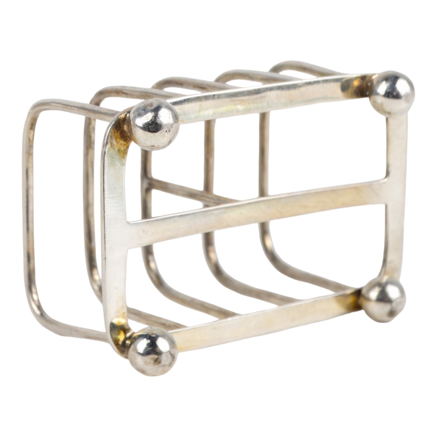 A small silver four division toast rack - Sheffield 1916, Martin Hall & Co Ltd, length 6.5cm, weight - Image 3 of 4