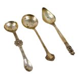 A Georg Jensen acorn grapefruit spoon - together with two further silver spoons, 75g