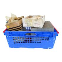 STAMPS - a small filing cabinet and a box crammed with world stamps sorted into packets.