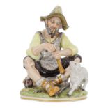 A Shepherd and his charge - Sandizell, Hoffner & Co, seated and whittling stick, 26cm high