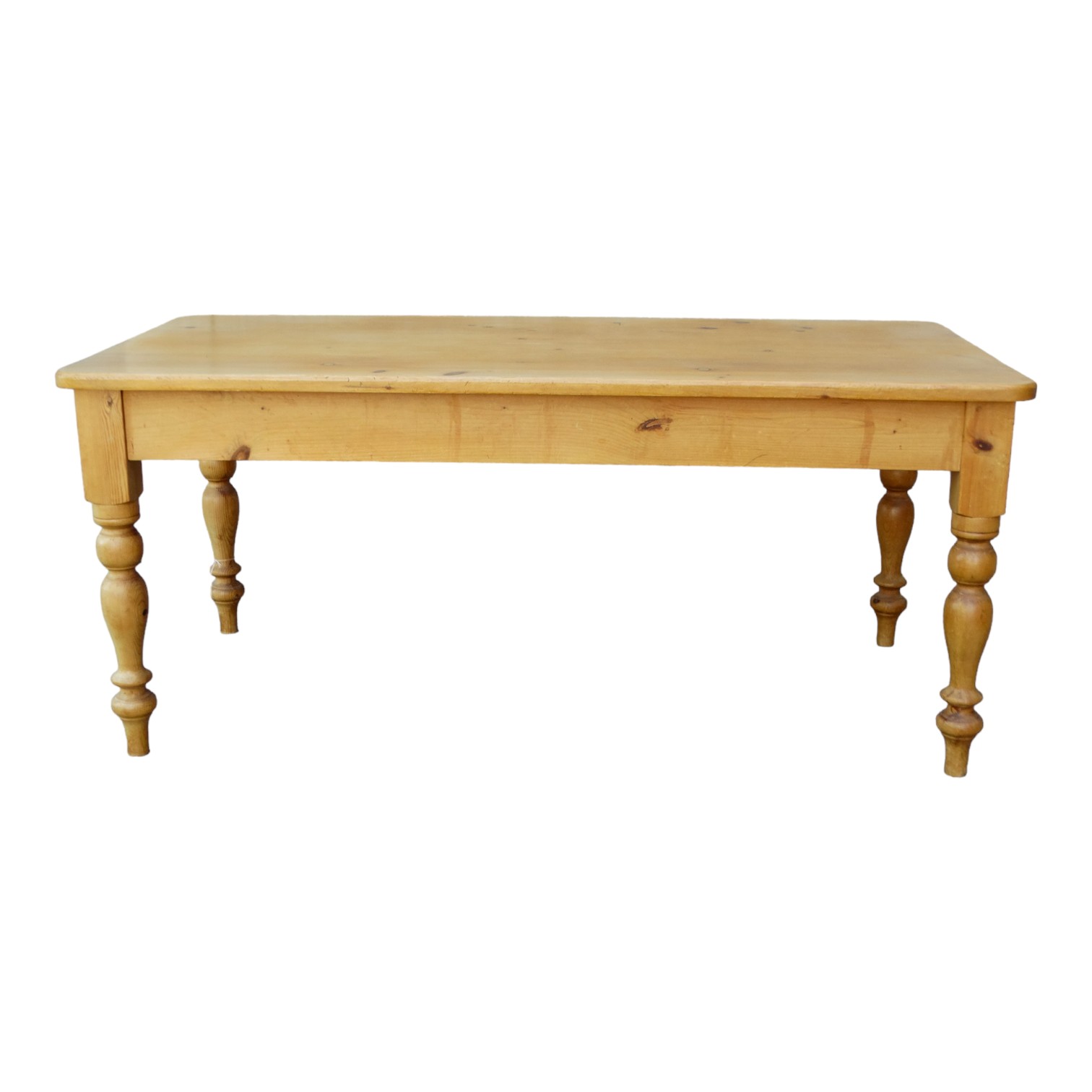 A 20th century pine kitchen table - with a rectangular plank top and raised on turned legs, 182 x 90