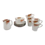An Art Deco style tea service by Collingwood - comprising five cups and saucers, a milk jug and a