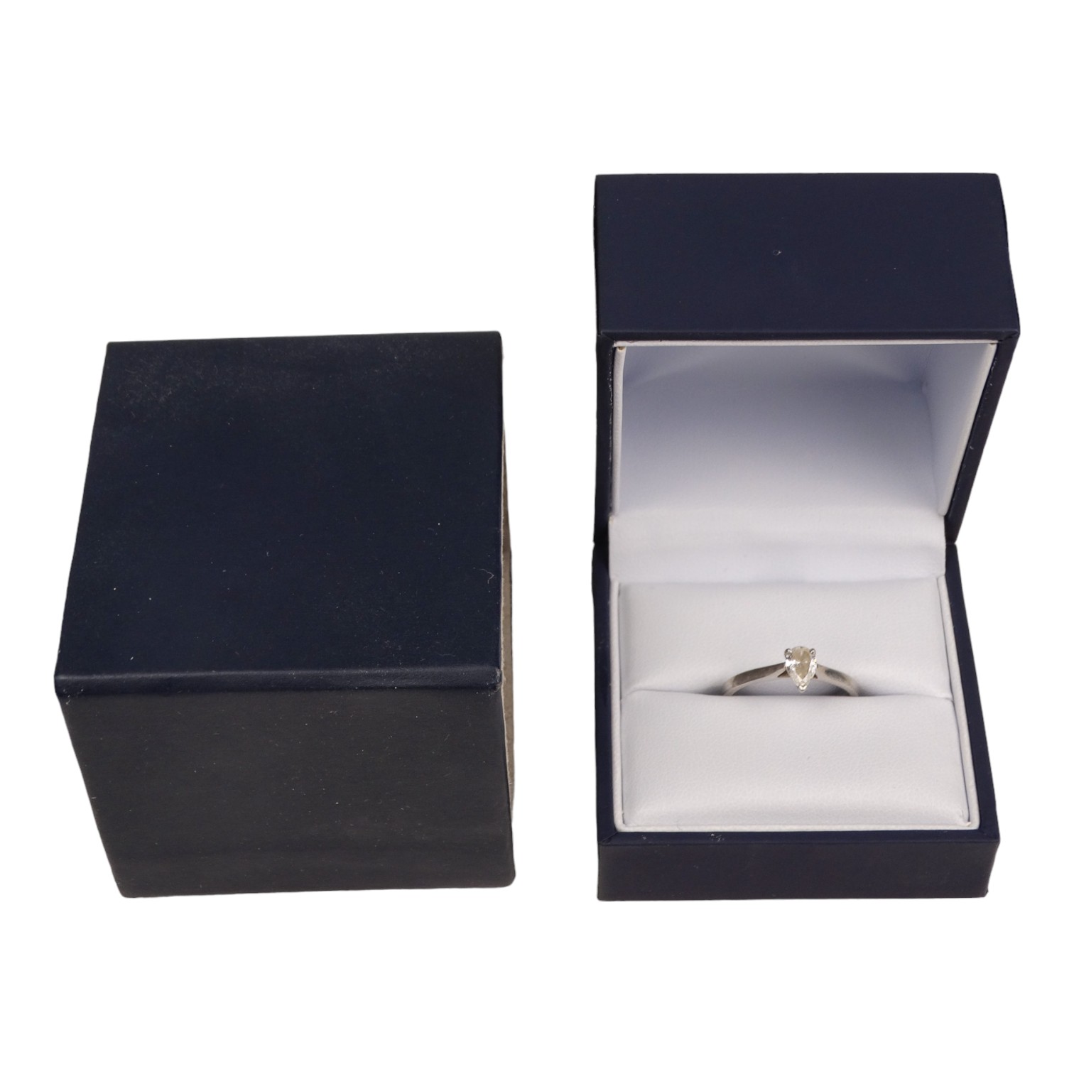 A platinum and diamond solitaire ring - the pear shaped diamond of 0.50ct approximately, VS2, colour