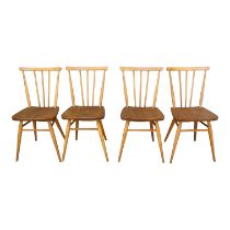 A set of four Ercol elm and beech chairs - with stick backs and contoured seats, on turned