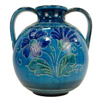 A late 20th century Italian twin handle vase - with sgraffito floral decoration on a blue ground,