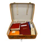 ACCUMULATION OF WORLD STAMPS - A brown suitcase containing a world accumulation of stamps in albums,