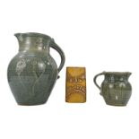 St Agnes Pottery jug - blue speckle glaze with incised floral design, impressed mark to base, height