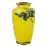 An early 20th century cloisonne vase - of baluster form decorated with an exotic bird on a yellow