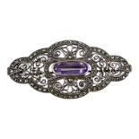 A silver marcasite and amethyst brooch, pierced and scrolled decoration,13g