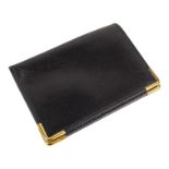 An Aquascutum black leather card wallet - with gilt metal corners, width 10.8cm, boxed.