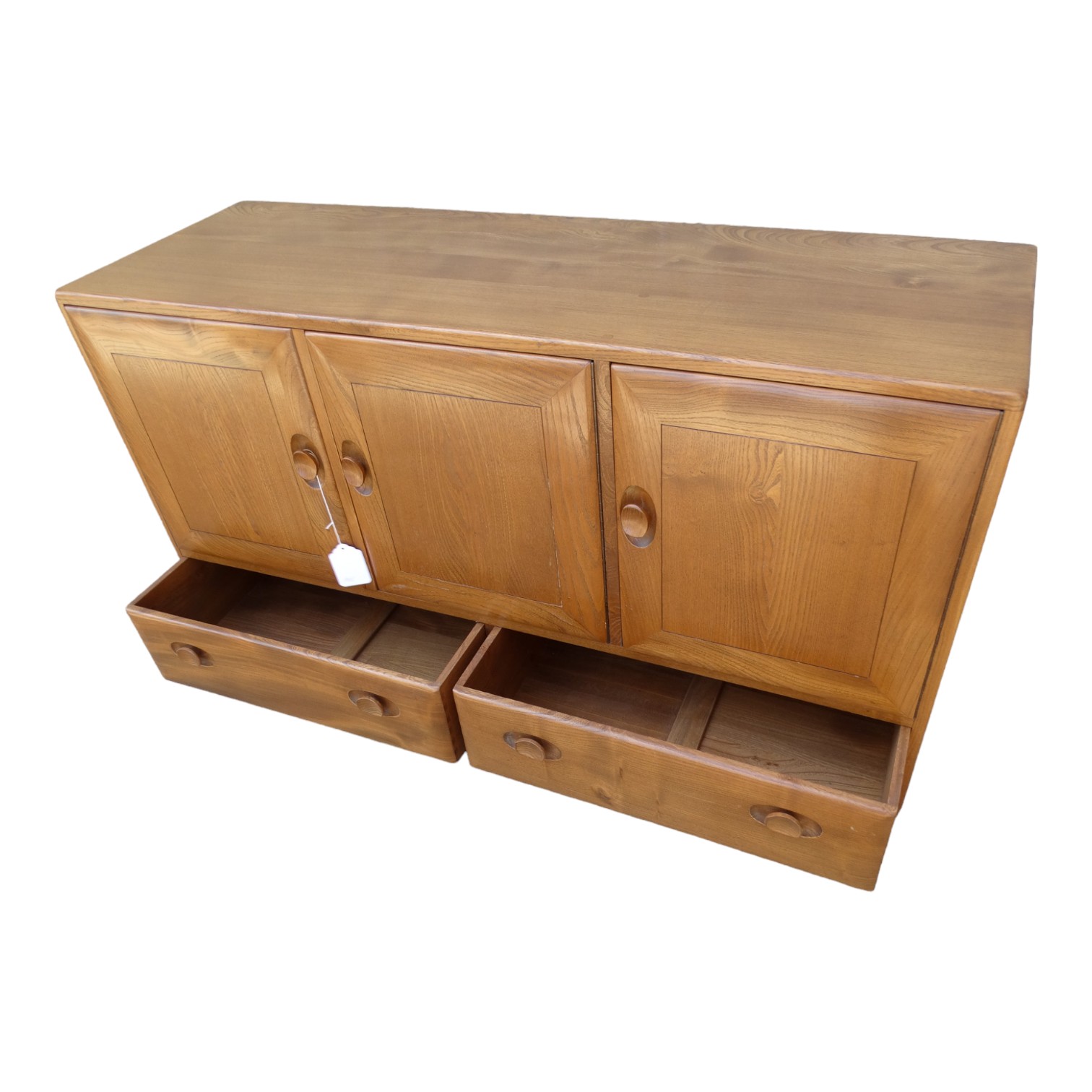 An Ercol elm sideboard - Windsor model 468, with an arrangement of three doors, each enclosing an - Image 4 of 5