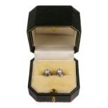 A pair of 18ct white gold diamond stud earrings - the total diamond weight of 1ct approximately.