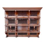 A Victorian walnut dresser back - with an arrangement of three shelves, and carved foliate panels,