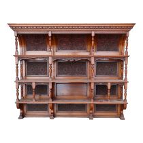 A Victorian walnut dresser back - with an arrangement of three shelves, and carved foliate panels,