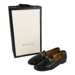 A pair of black Gucci loafers - size 39, boxed with retail bag,