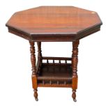 An Edwardian walnut octagonal centre table - the turned legs joined by a galleried undertier, 74 x