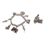 A silver charm bracelet - with seven charms with a heart shaped padlock clasp, together with a