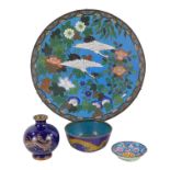 A late 19th century cloisonne plate - decorated with a pair of flying cranes, on a blue and