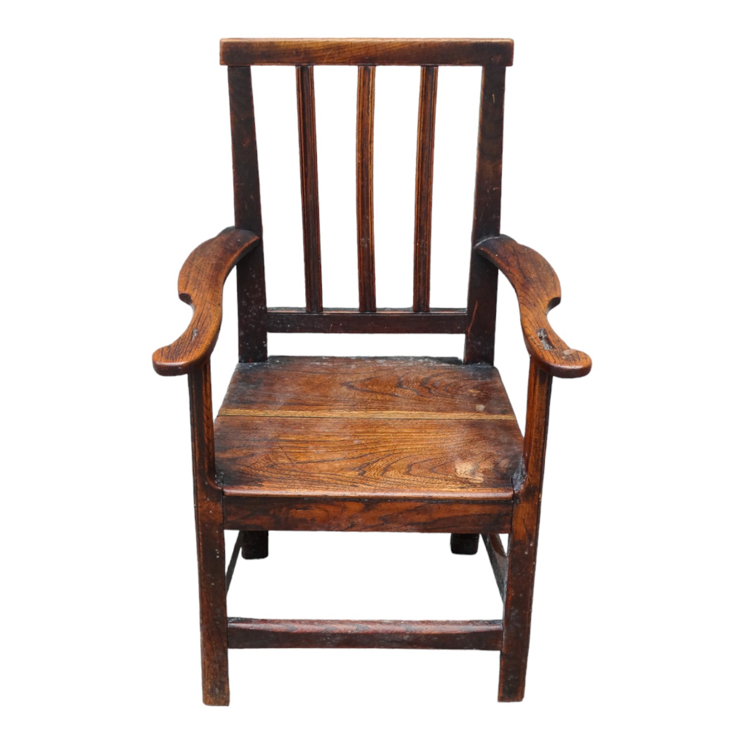 A late 18th century elm child's chair - the stick back above open arms and solid seat on square legs