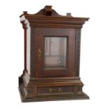 A late 19th century mahogany table top cabinet smoker's cabinet - with a glazed panel door enclosing