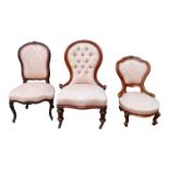 A Victorian spoon back nursing chair - button upholstered in pink jacquard fabric, together with two