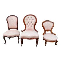 A Victorian spoon back nursing chair - button upholstered in pink jacquard fabric, together with two