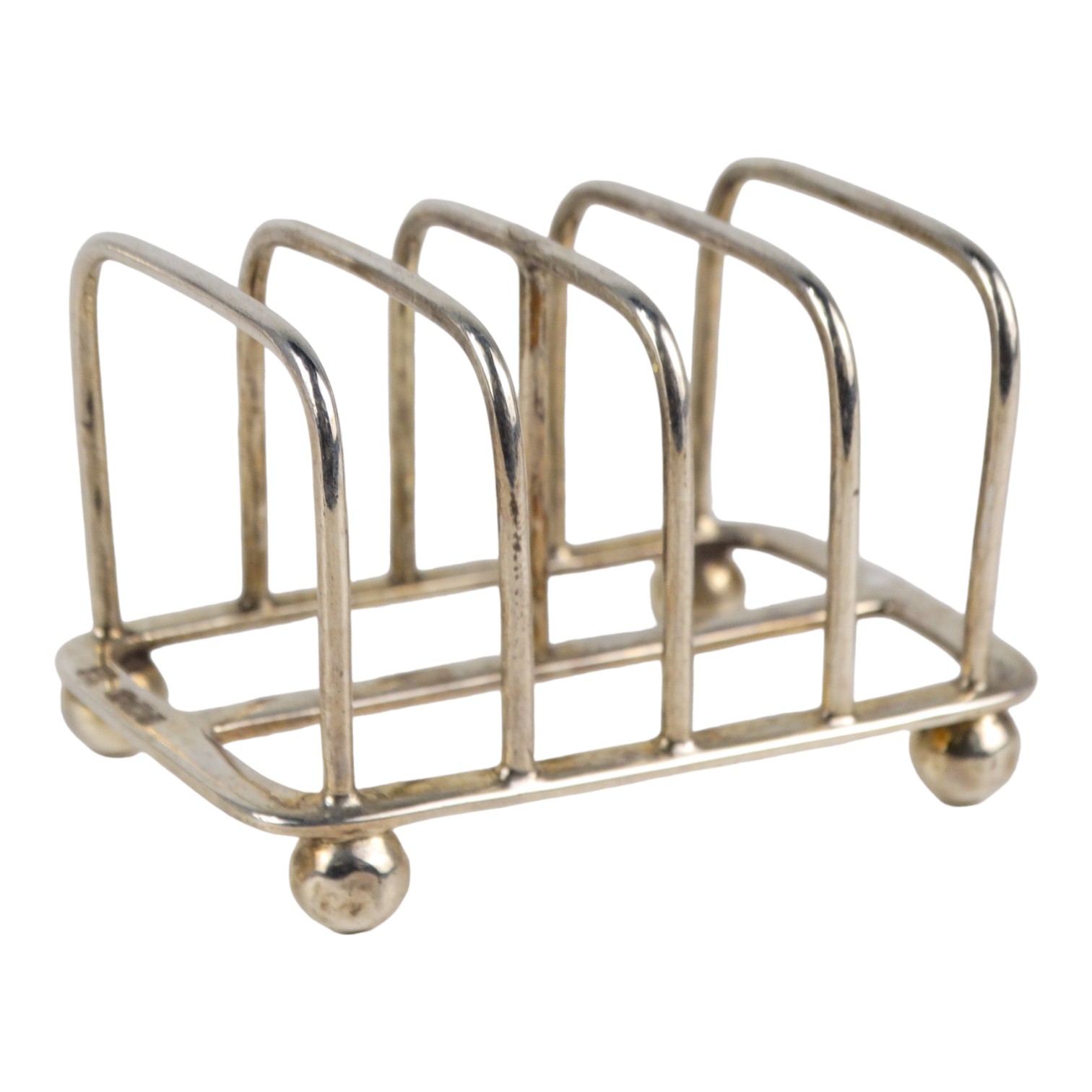 A small silver four division toast rack - Sheffield 1916, Martin Hall & Co Ltd, length 6.5cm, weight - Image 2 of 4