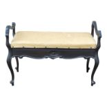 An Edwardian ebonised duet stool - the upholstered seat with yellow jacquard weave upholstery