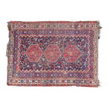 A Persian rug - with an arrangement of three serrated gulls on a blue ground with zoomorphic images,